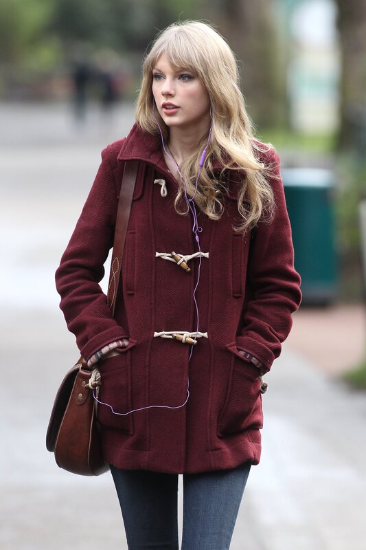 woman in red coat walking