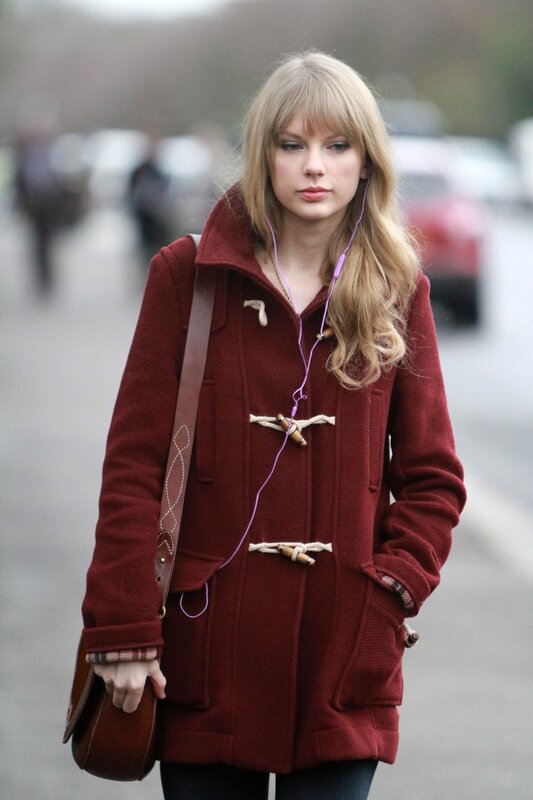 woman in red coat walking