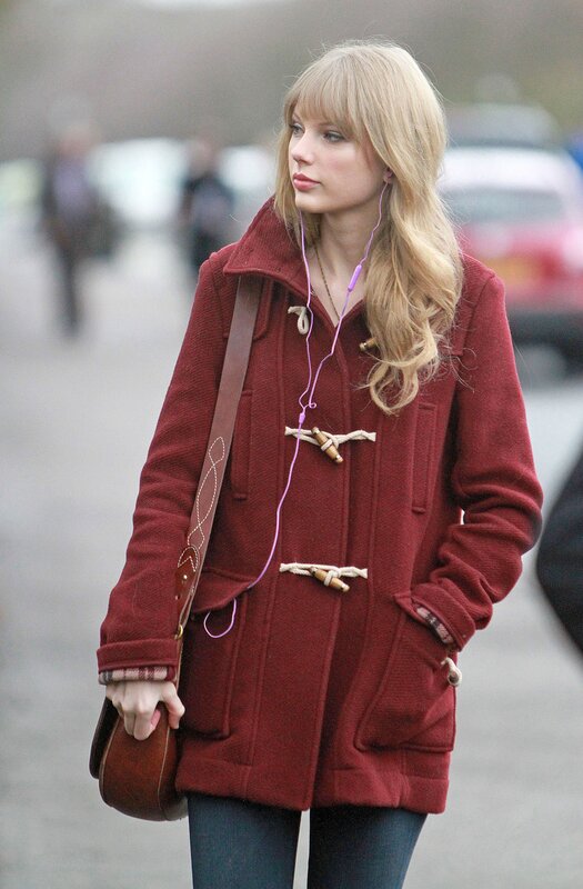 woman in red coat walking