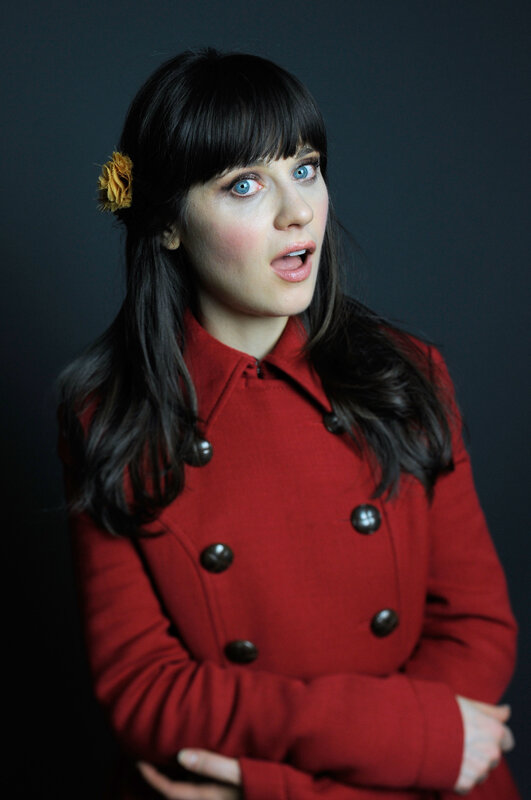 woman in red coat with flower