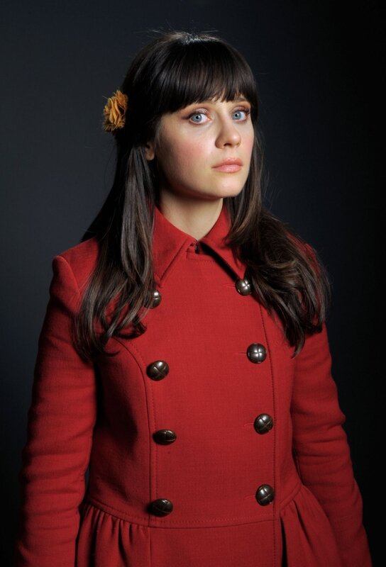 woman in red coat with flower