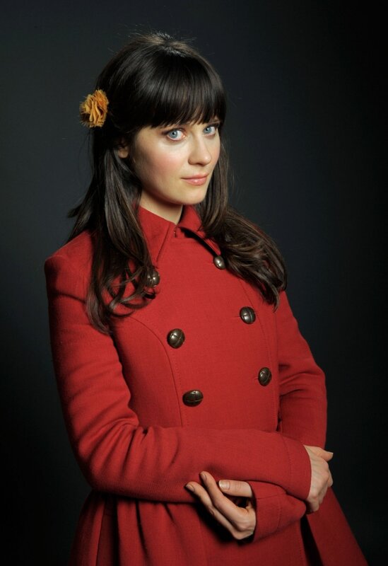 woman in red coat with flower