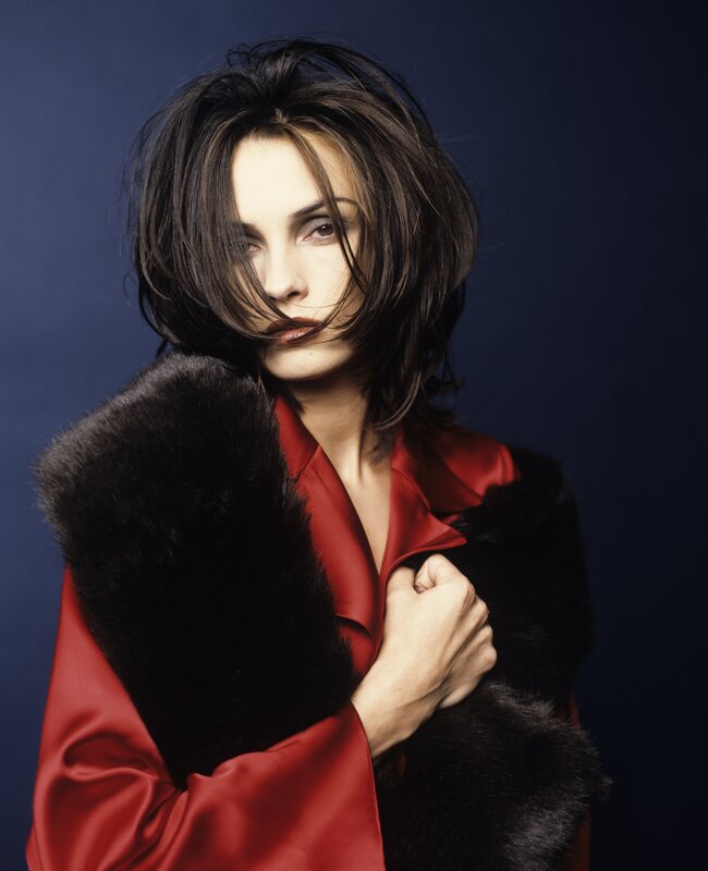 woman in red coat with fur collar