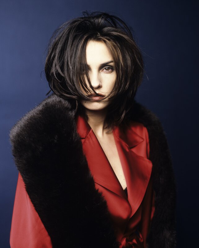 woman in red coat with fur collar