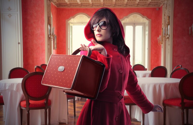 Woman in red coat with handbag