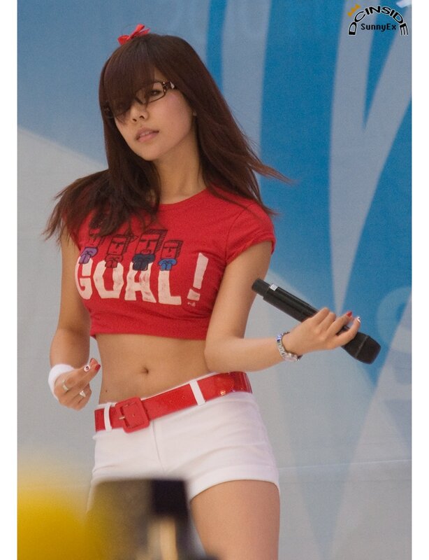 woman in red crop top performing