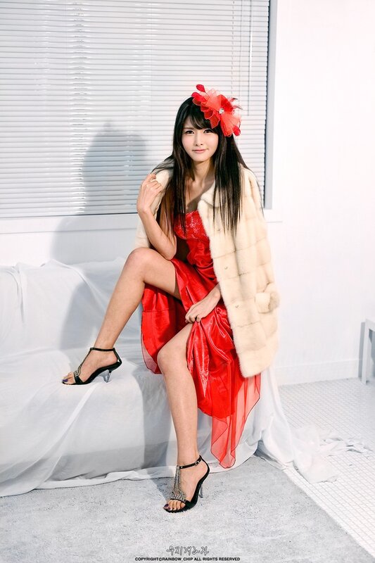 woman in red dress and fur coat