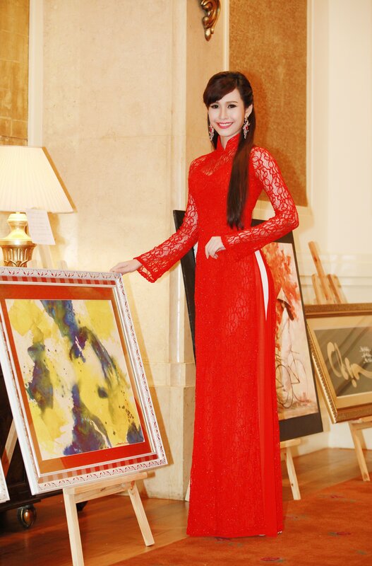 Woman in red dress at art gallery