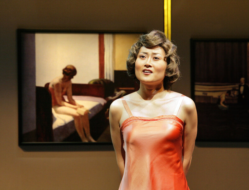 Woman in red dress at art gallery