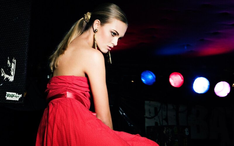 woman in red dress at night club