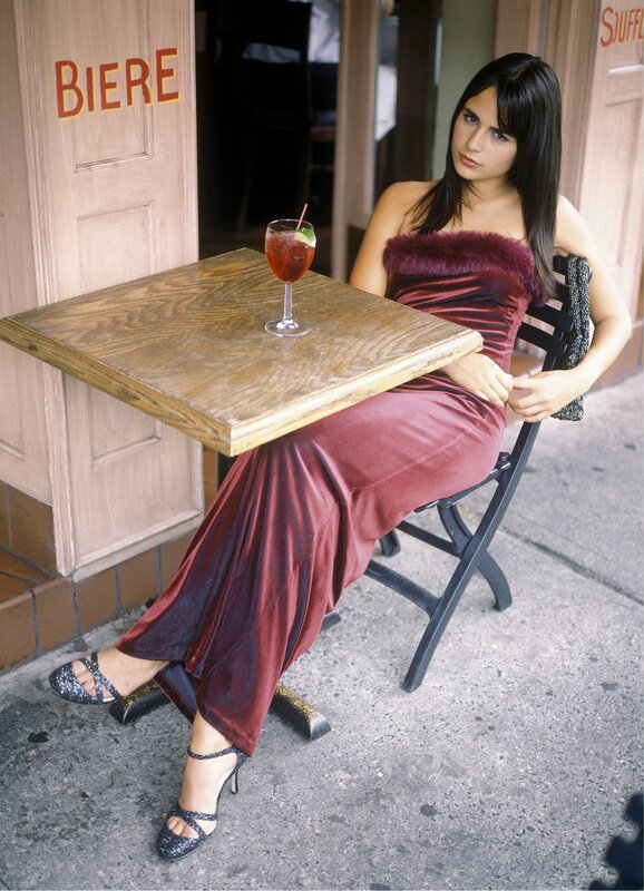 Woman in red dress at outdoor table