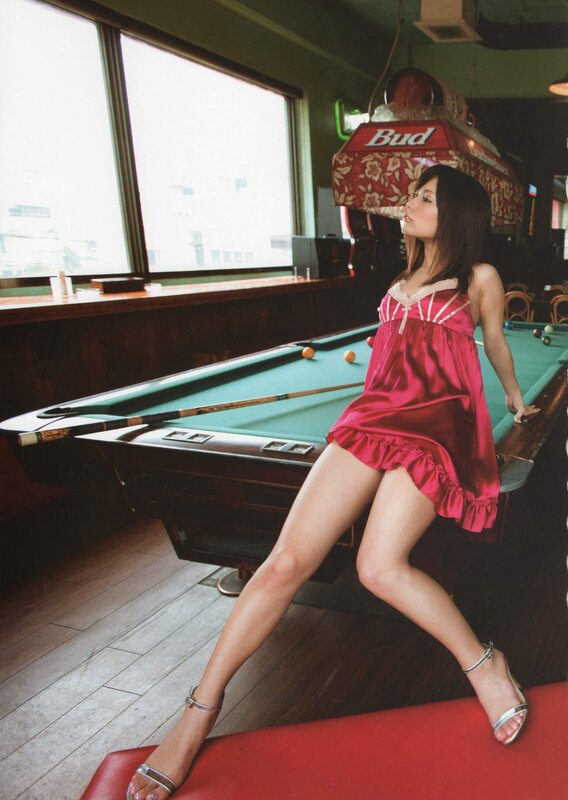 Woman in red dress at pool table