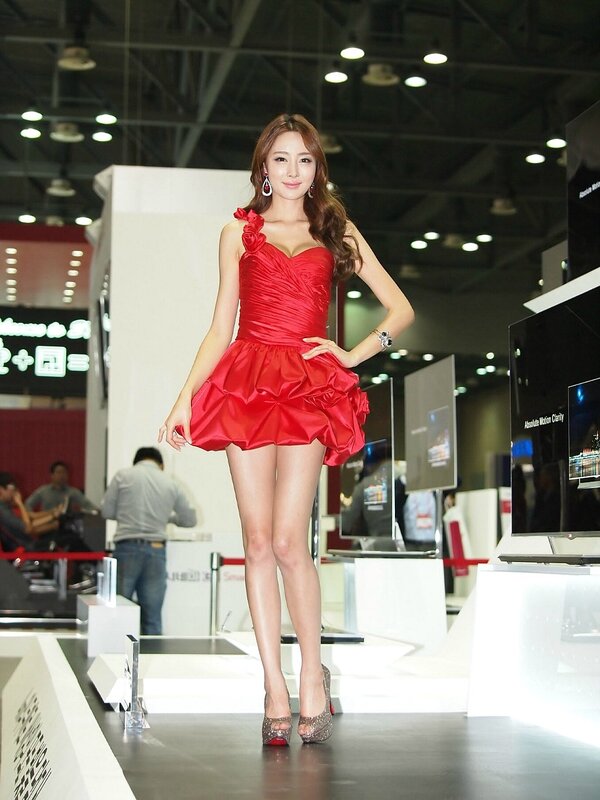 Woman in red dress at tech event