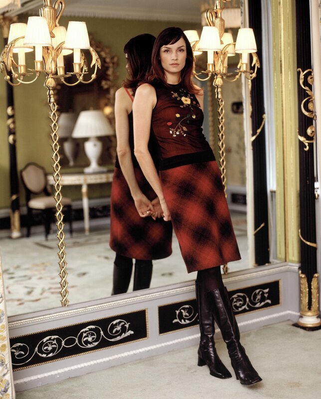 woman in red dress by mirror