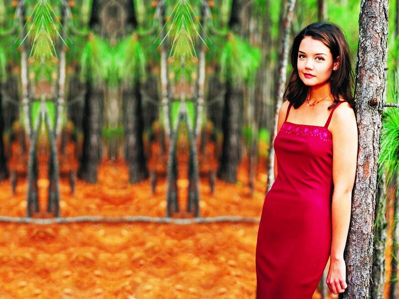 woman in red dress by tree
