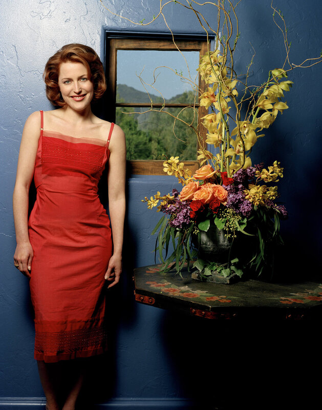 Woman in red dress by window