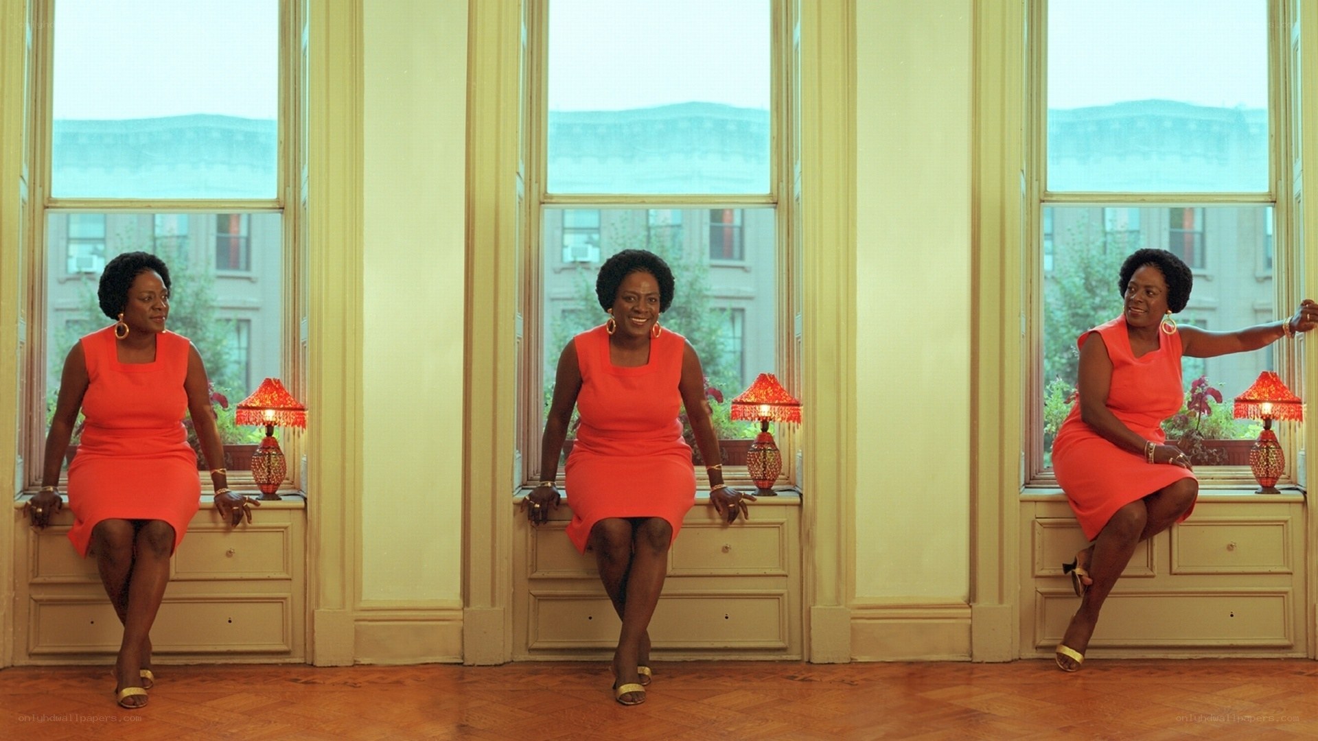 Woman in red dress by windows