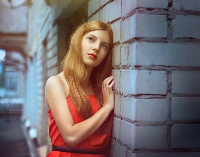 Woman in Red Dress — Contemplative, Afternoon, Photograph, Brick Wall