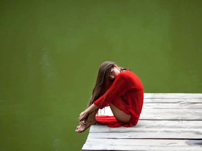 Woman in Red Dress — Contemplative