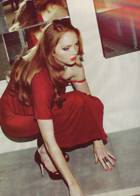 Woman in red dress crouching
