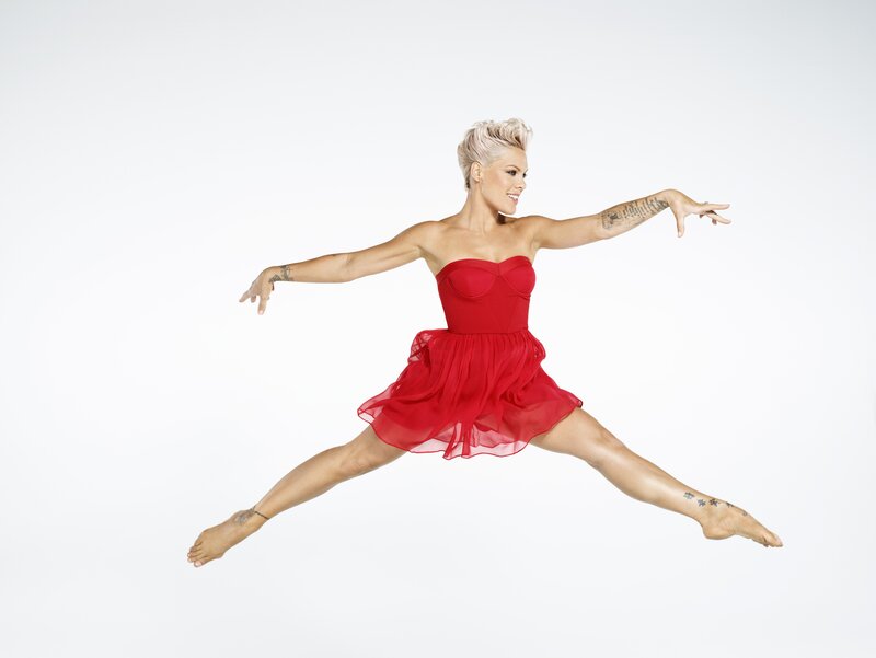 woman in red dress dancing