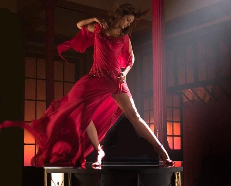 woman in red dress dancing