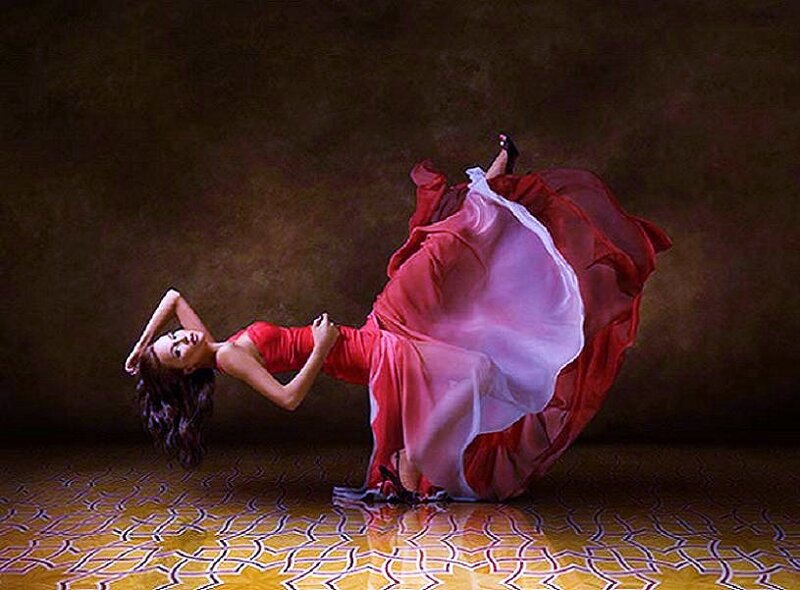 woman in red dress dancing