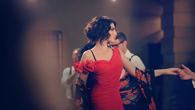 woman in red dress dancing