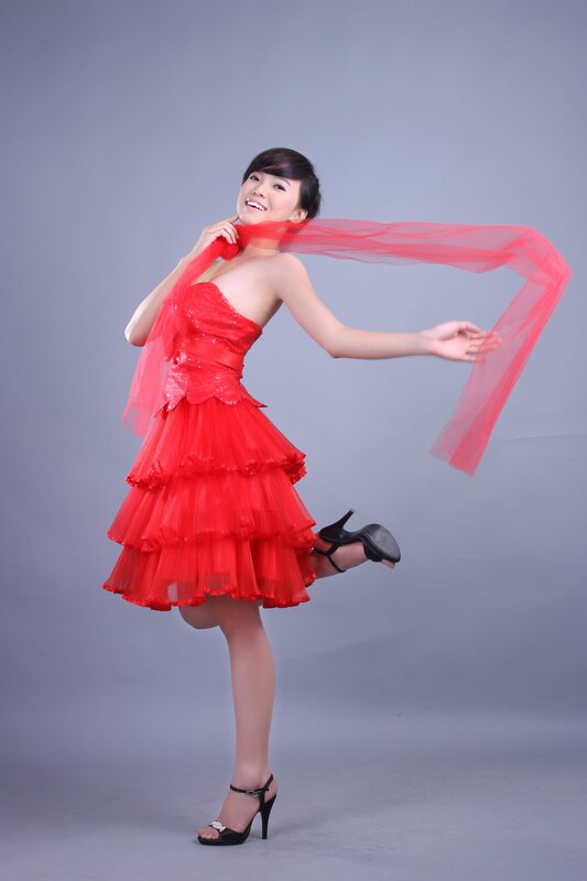 woman in red dress dancing