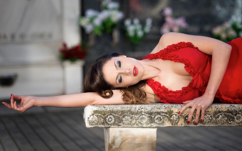 Woman in Red Dress — Dramatic, Afternoon, Photograph, Bench, Flowers
