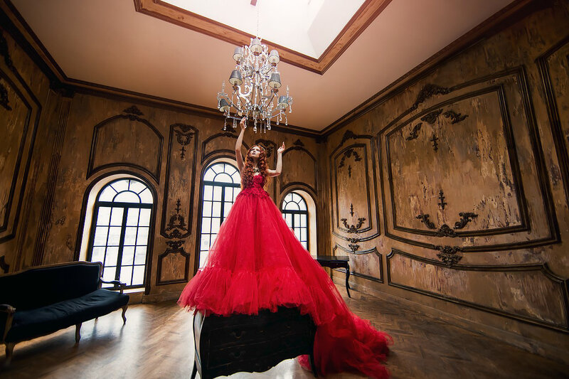 Woman in Red Dress — Dramatic, Photograph, Chandelier