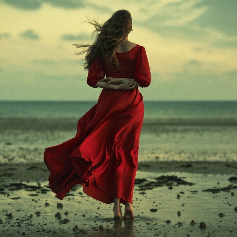 Woman in Red Dress — Dramatic, Sunset, Photograph, Beach, Ocean, Wind