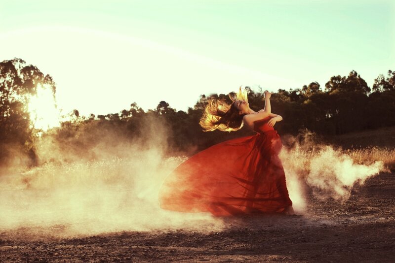 Woman in Red Dress — Dramatic, Sunset, Photograph, Dust