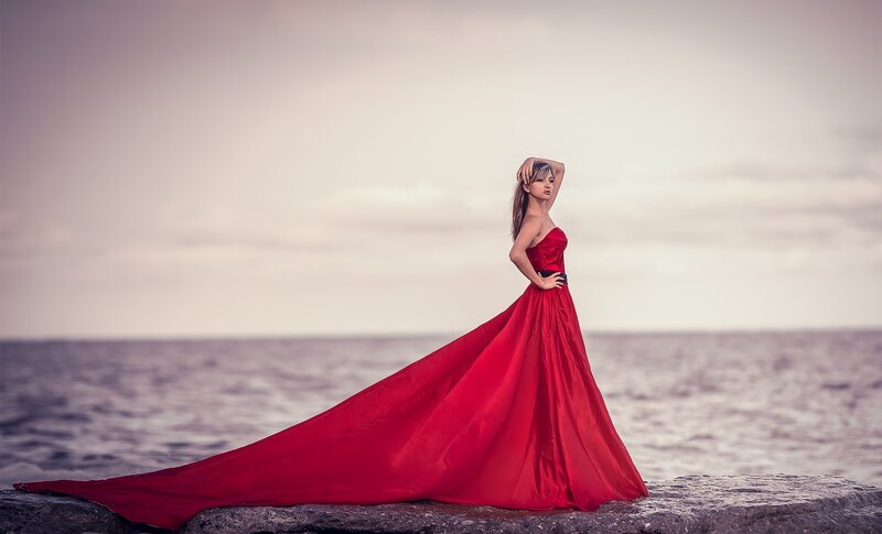 Woman in Red Dress — Dramatic, Sunset, Photograph, Ocean, Rocks