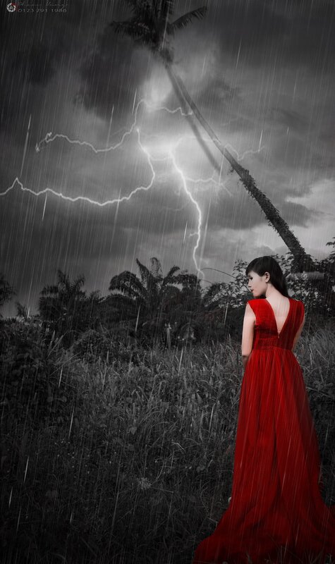 Woman in red dress during storm