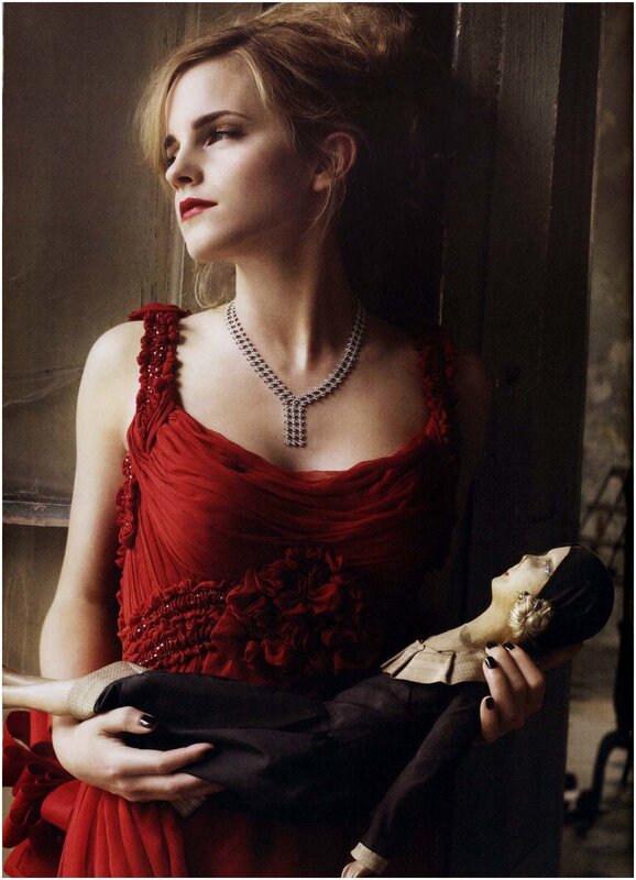 Woman in red dress holding doll