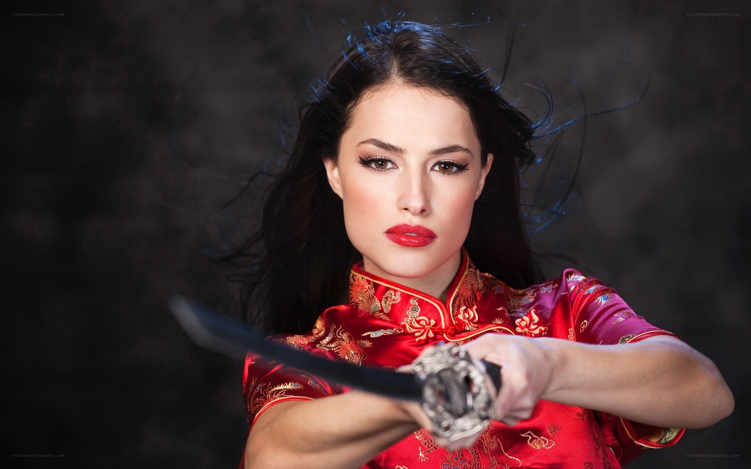 woman in red dress holding sword