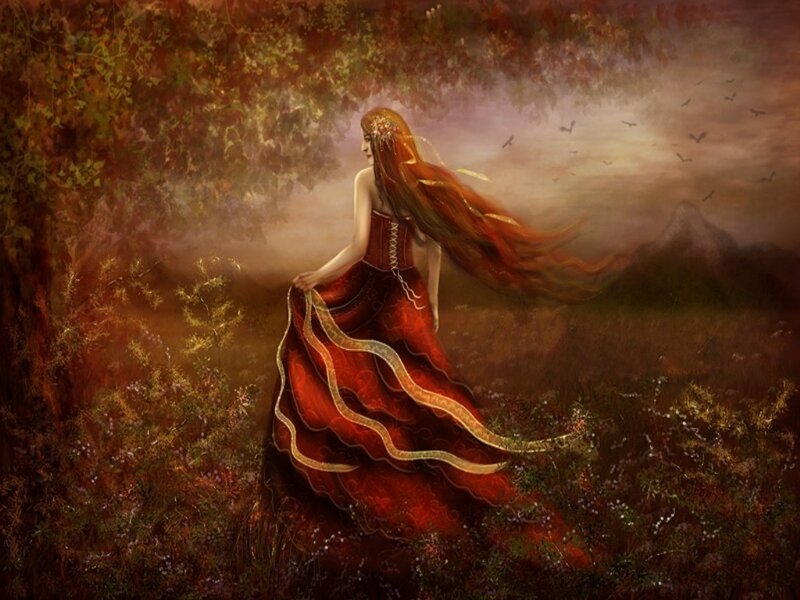 Woman in red dress in autumn forest