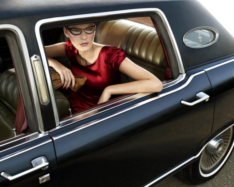 woman in red dress in classic car