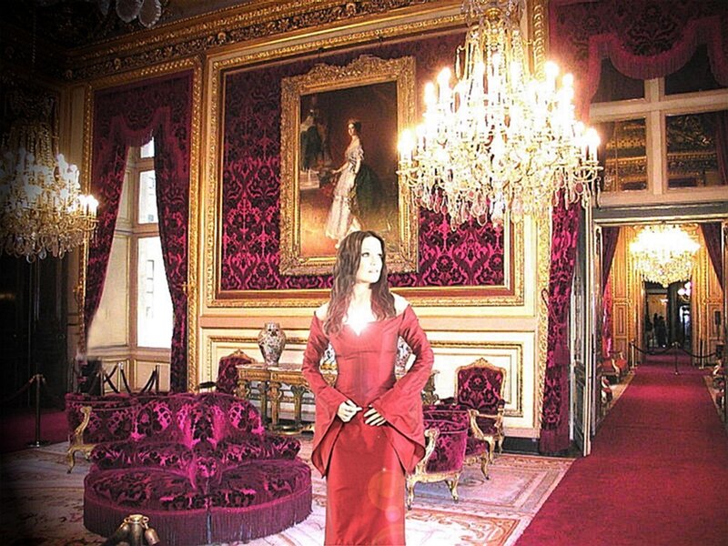 woman in red dress in palace hall