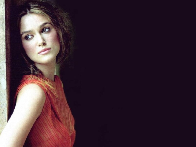 woman in red dress looking away