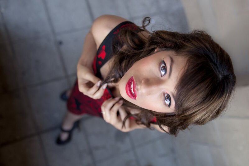 woman in red dress looking up