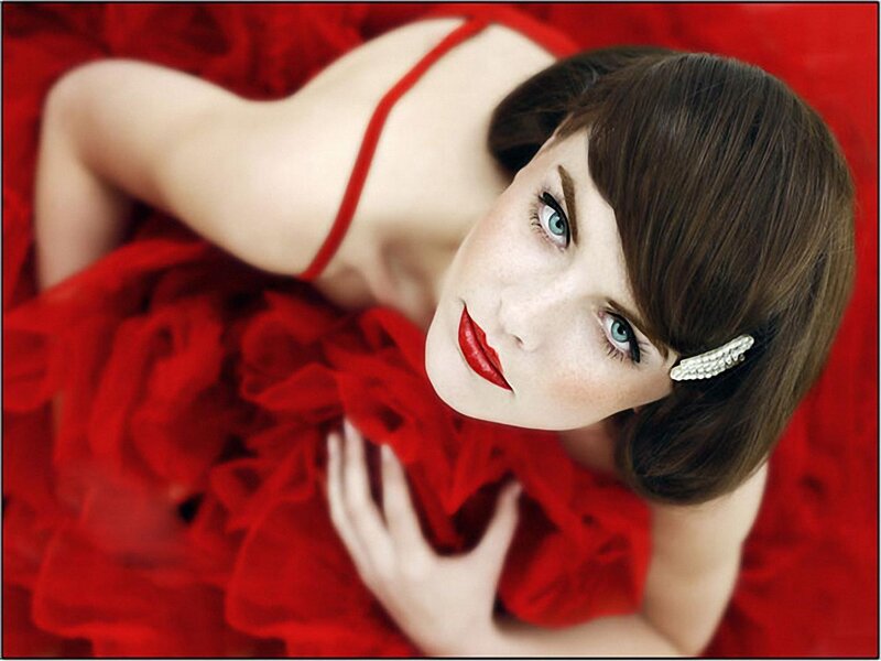 woman in red dress looking up