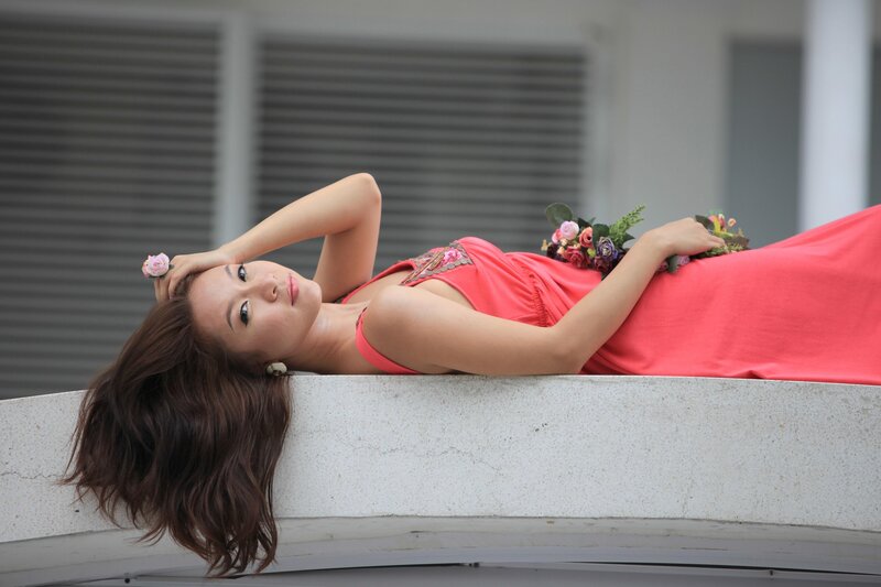 Woman in red dress lying down