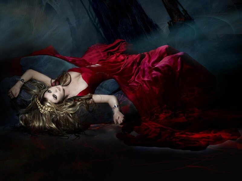 woman in red dress lying down