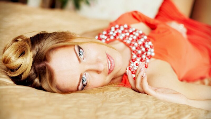 woman in red dress lying down
