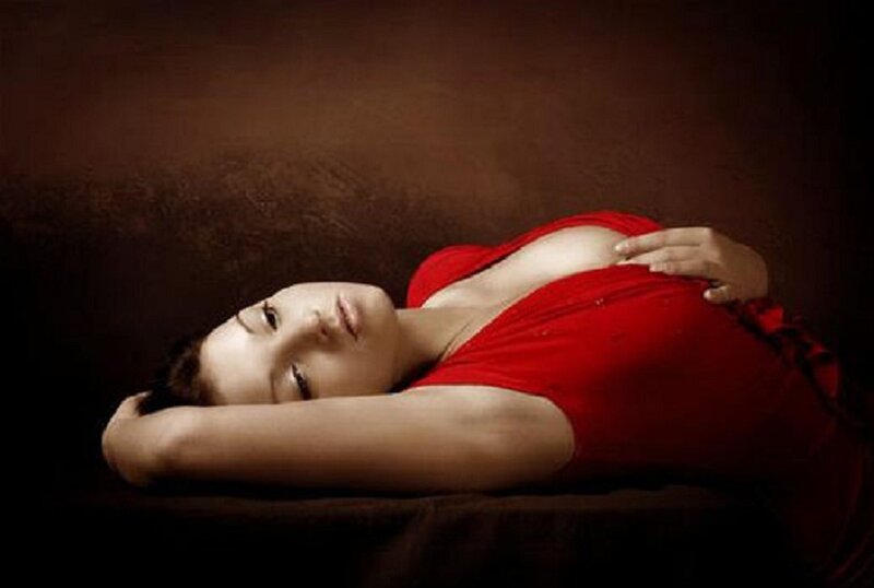 Woman in red dress lying down