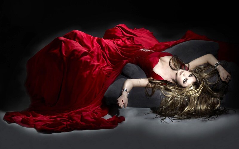woman in red dress lying down