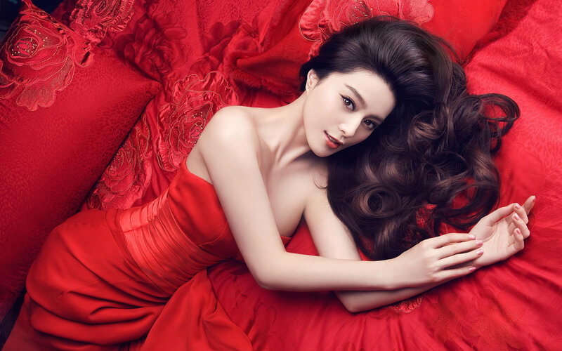 woman in red dress lying down