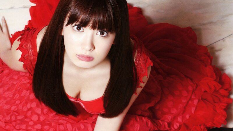 woman in red dress lying down
